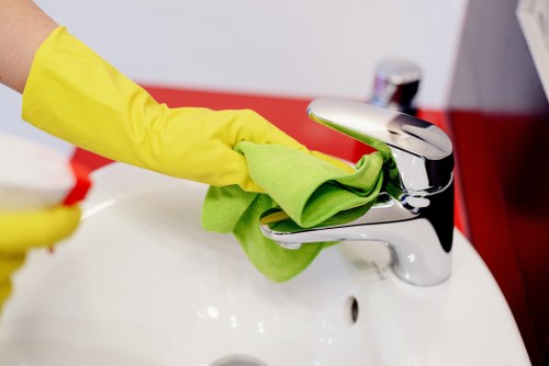 Technician cleaning a living room couch with specialist equipment